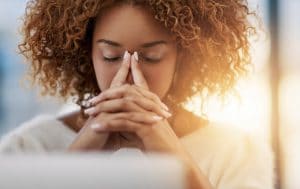 anxious woman in front of laptop